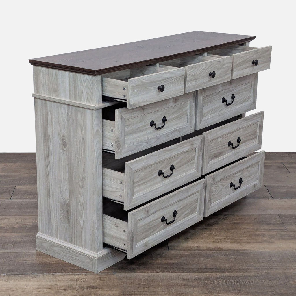 Side view of the Linsay Home dresser showing its 9 extended drawers.