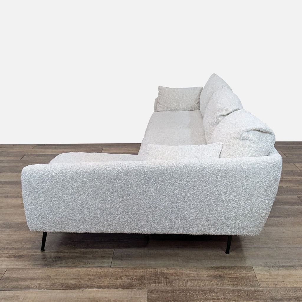 Side view of Albany Park sectional, showcasing plush cushions and sleek design.