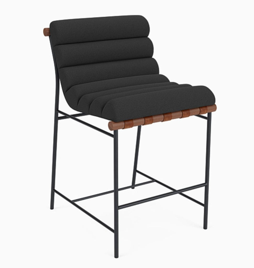 Front view of charcoal boucle stool with walnut wood, steel frame, and leather straps.