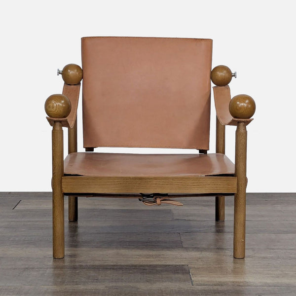 Front view of a Safari chair with oak frame and leather sling-back by Rachel Donath.