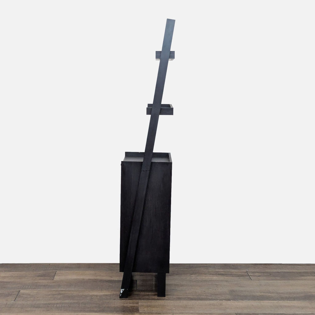 3. Side view of a leaning bookshelf with a sleek, modern design.