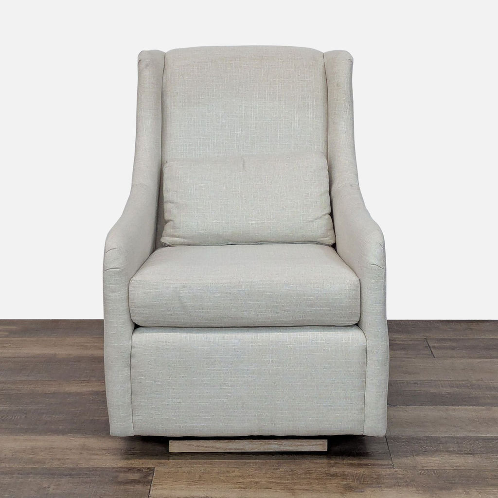 Lounge chair with clean lines, curved arms, and linen blend upholstery by Pottery Barn Kids.