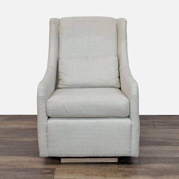 Lounge chair with clean lines, curved arms, and linen blend upholstery by Pottery Barn Kids.