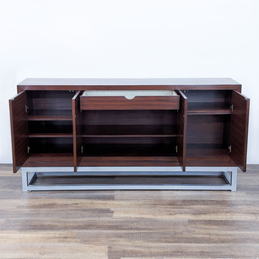 Open cabinet revealing shelves and silverware drawer.