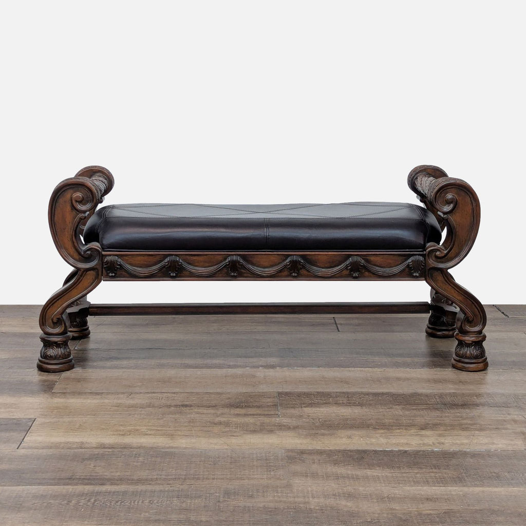 Elegant wood-framed bench with ornate carvings, padded vinyl seat, and curved legs.