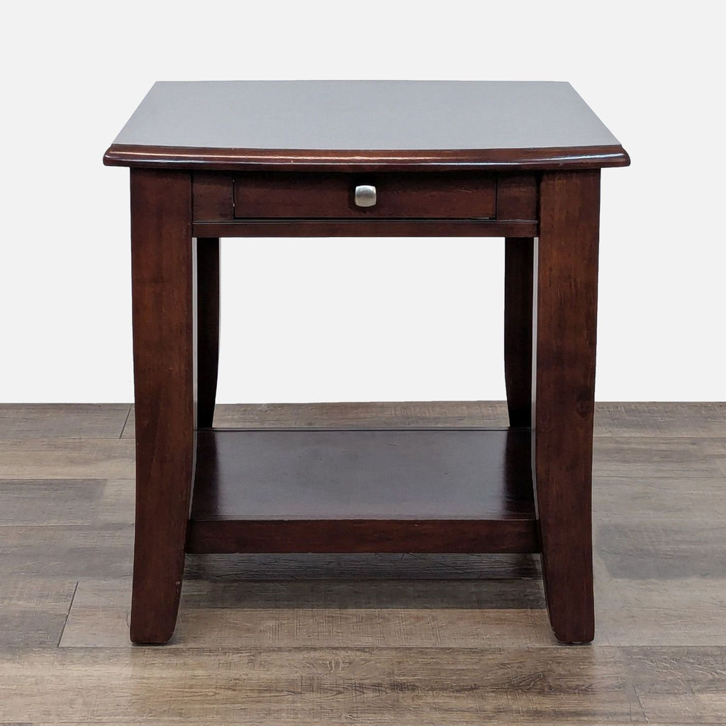 1. Reperch wooden end table with a dark finish, featuring a drawer and lower shelf, shown on wood flooring.