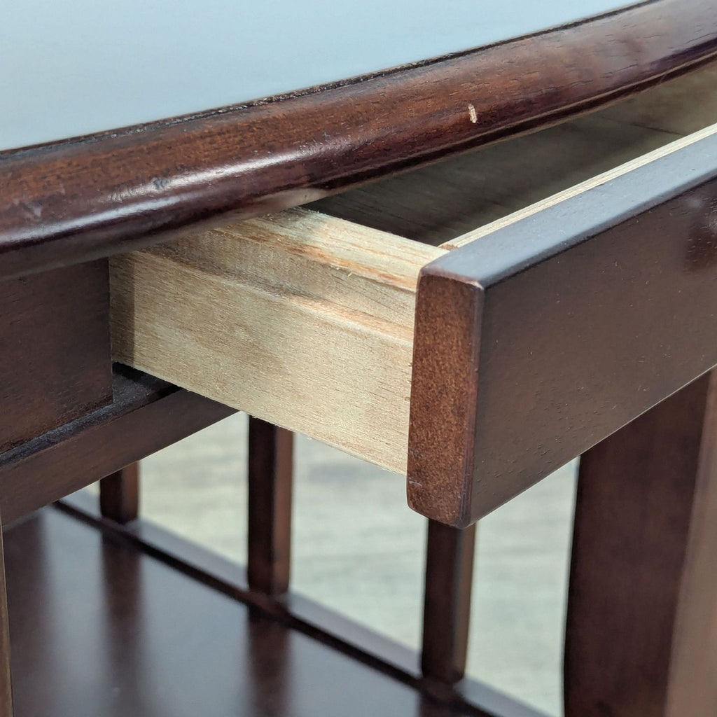 3. Close-up of the Reperch end table drawer, highlighting its wood texture and construction.