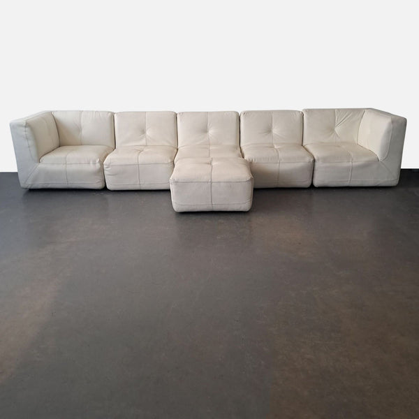 1. White leather Chateau D’ax sectional sofa with corner, seat modules, and ottoman on wood feet, modular design.  