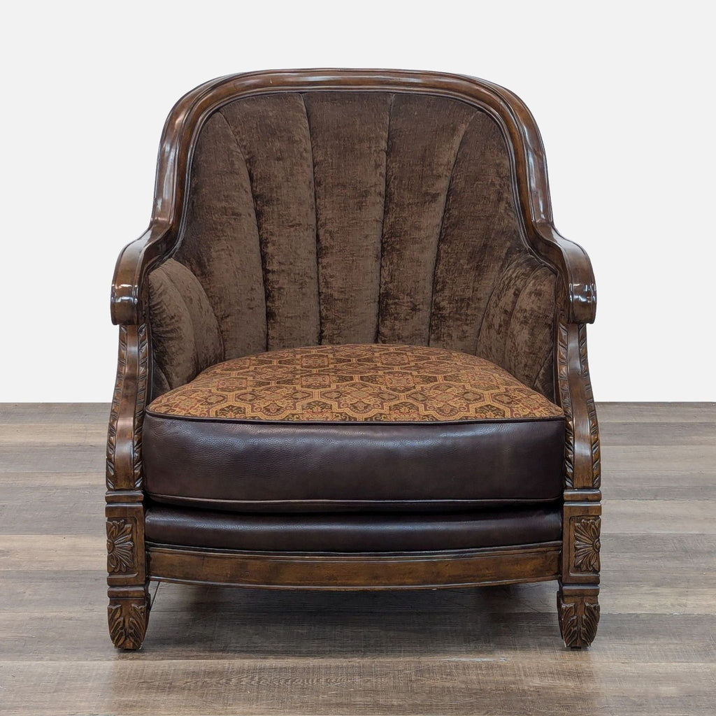 Lounge chair with carved wood frame and tufted back, featuring leather and tapestry upholstery.
