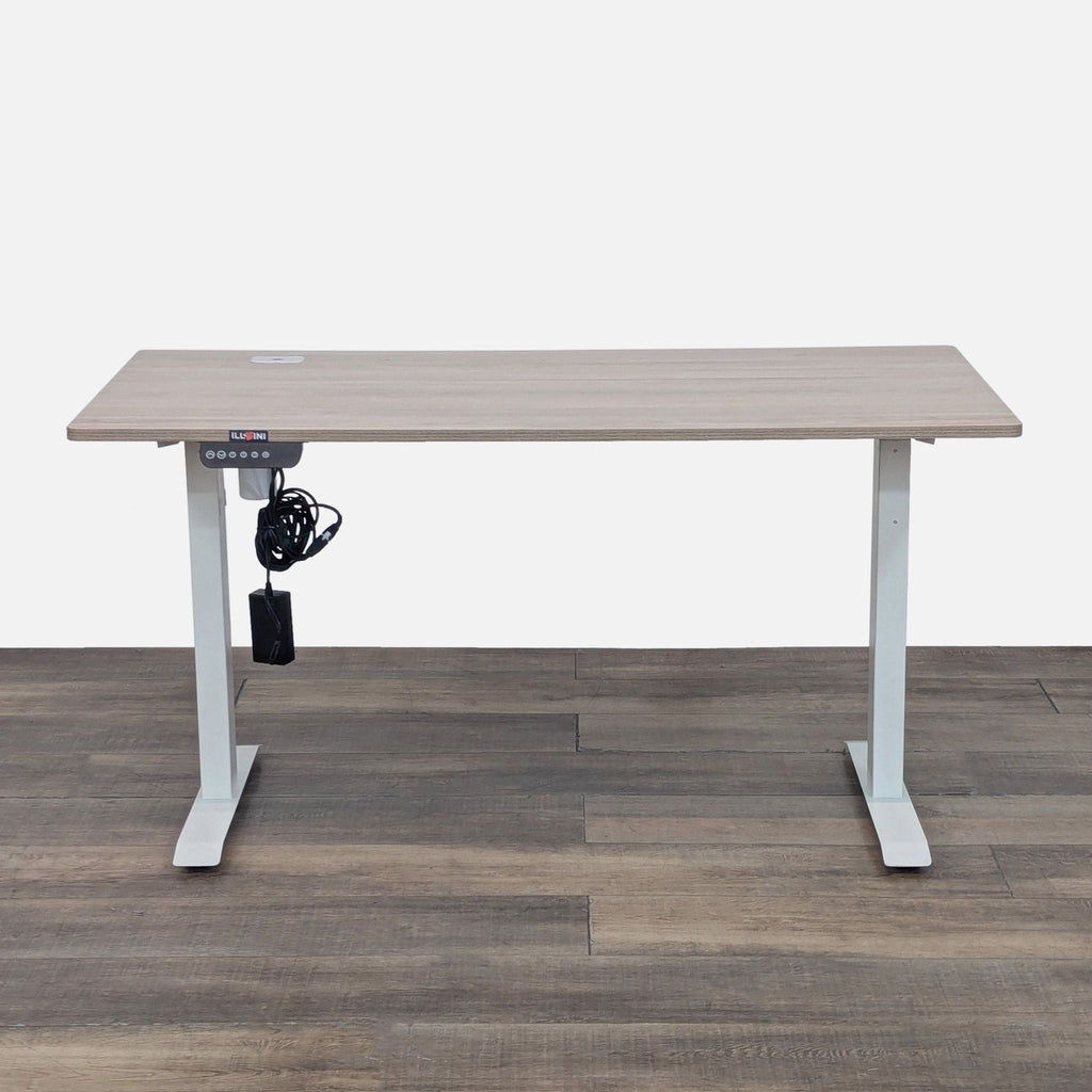 Adjustable standing desk with digital control on wood floor.