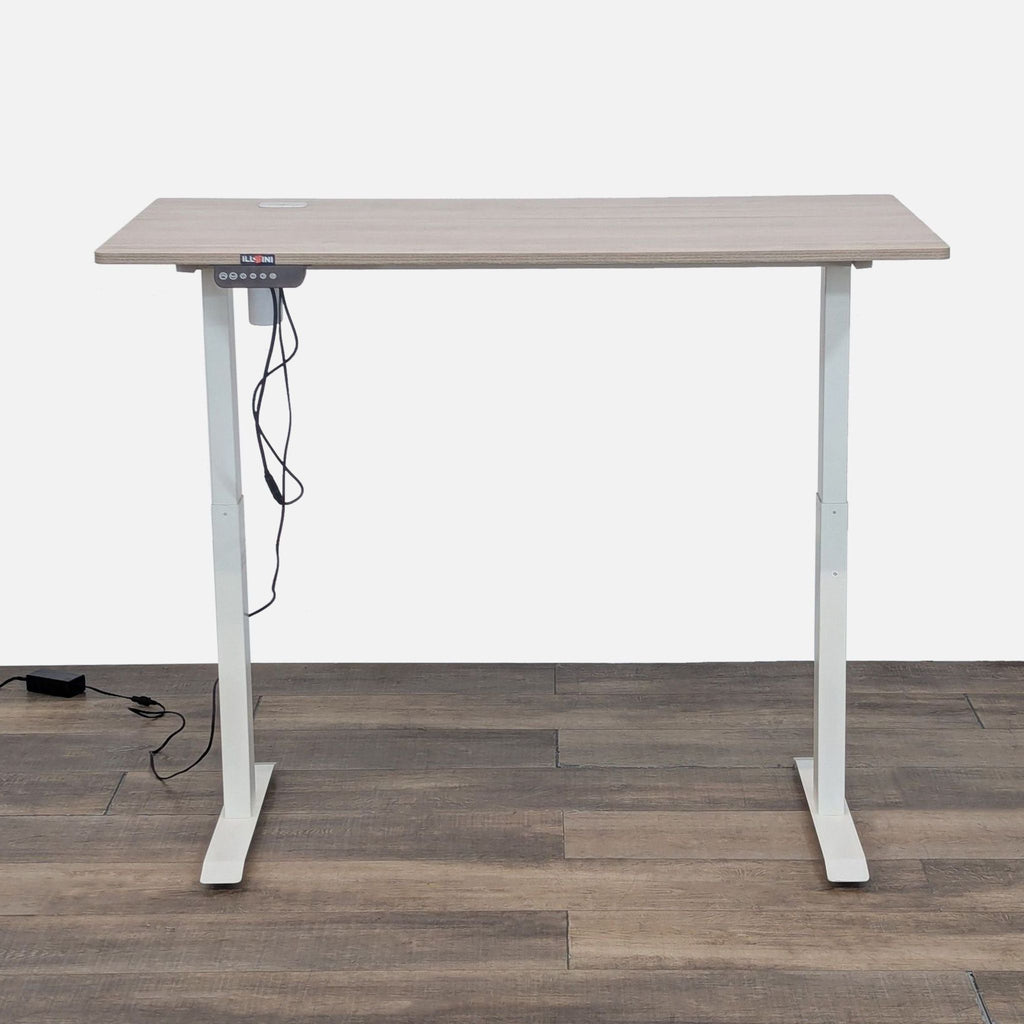 Programmable height desk with wood top and white base.