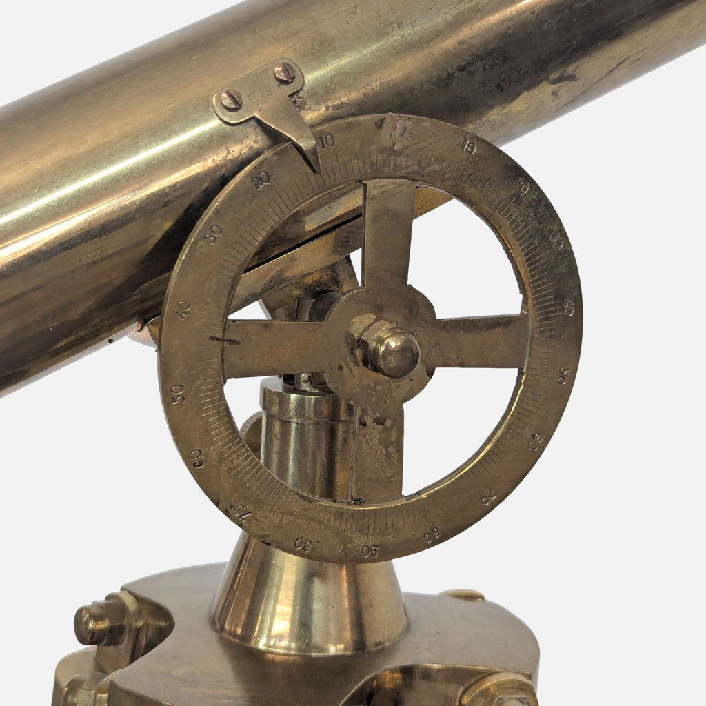 Detailed view of brass angle adjustment mechanism on telescope.