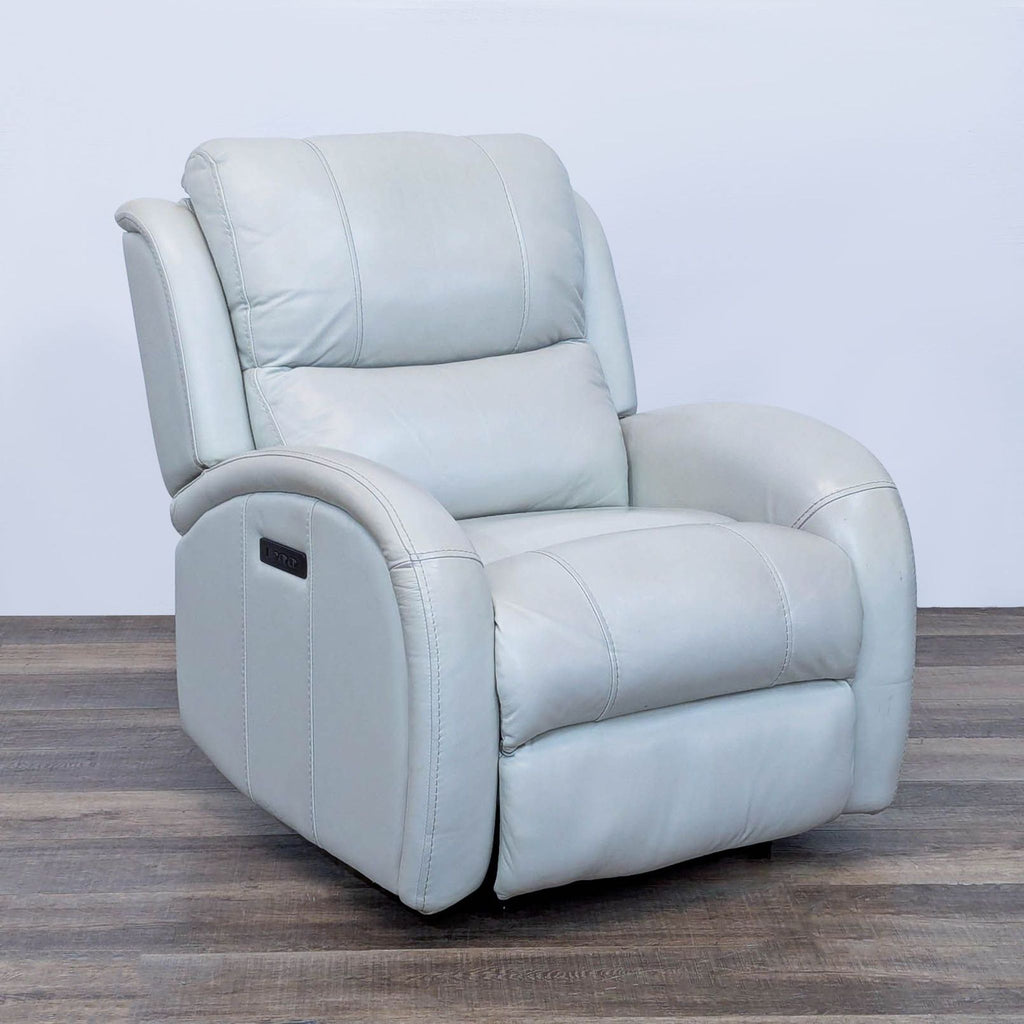 3. Contemporary Reperch leather recliner, angled view, highlighting padded arms and USB port on the side.