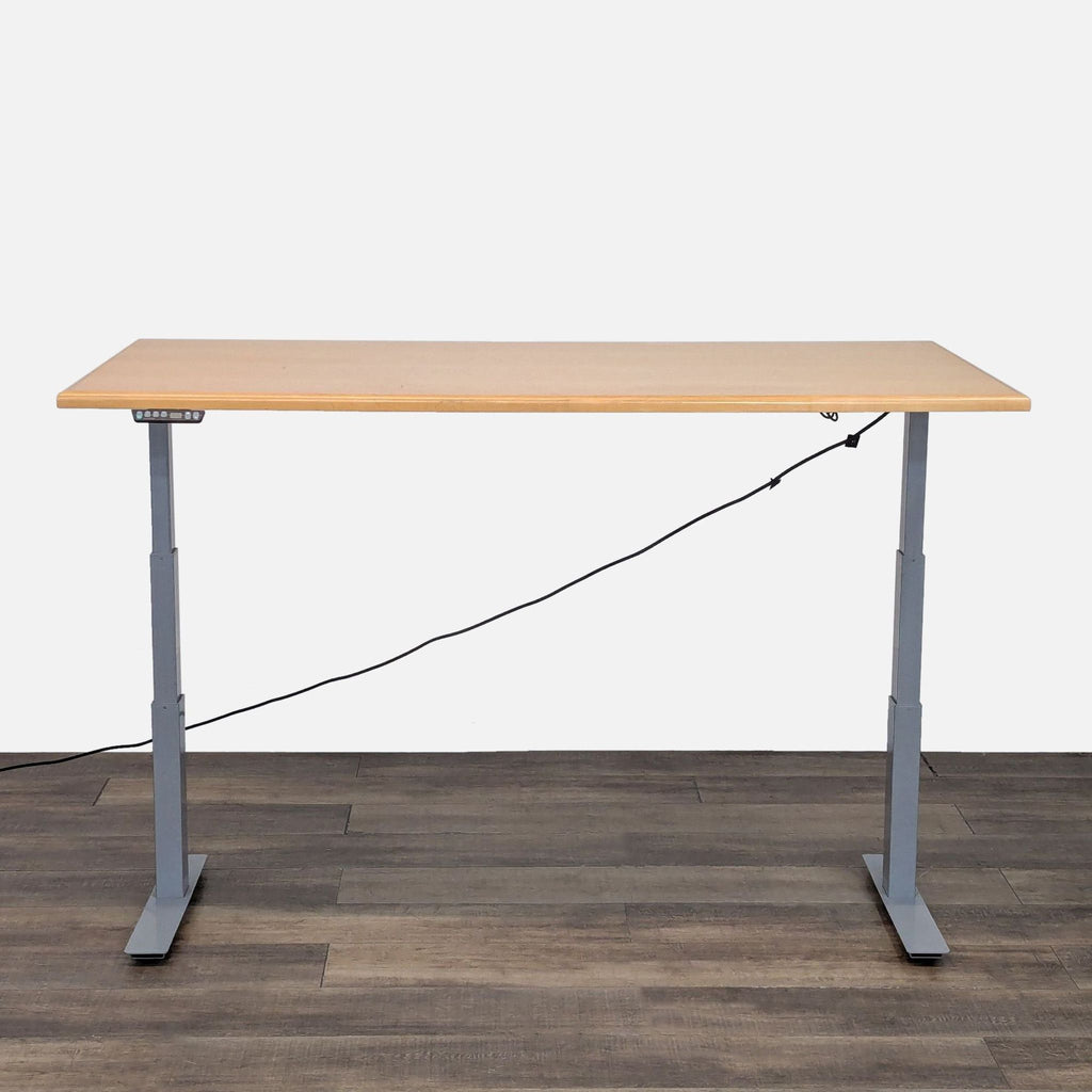 Adjustable Reperch desk with sleek wood finish, raised position showing keypad.