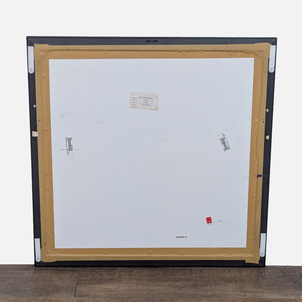 Back view of framed art print with mounting details and brand label.