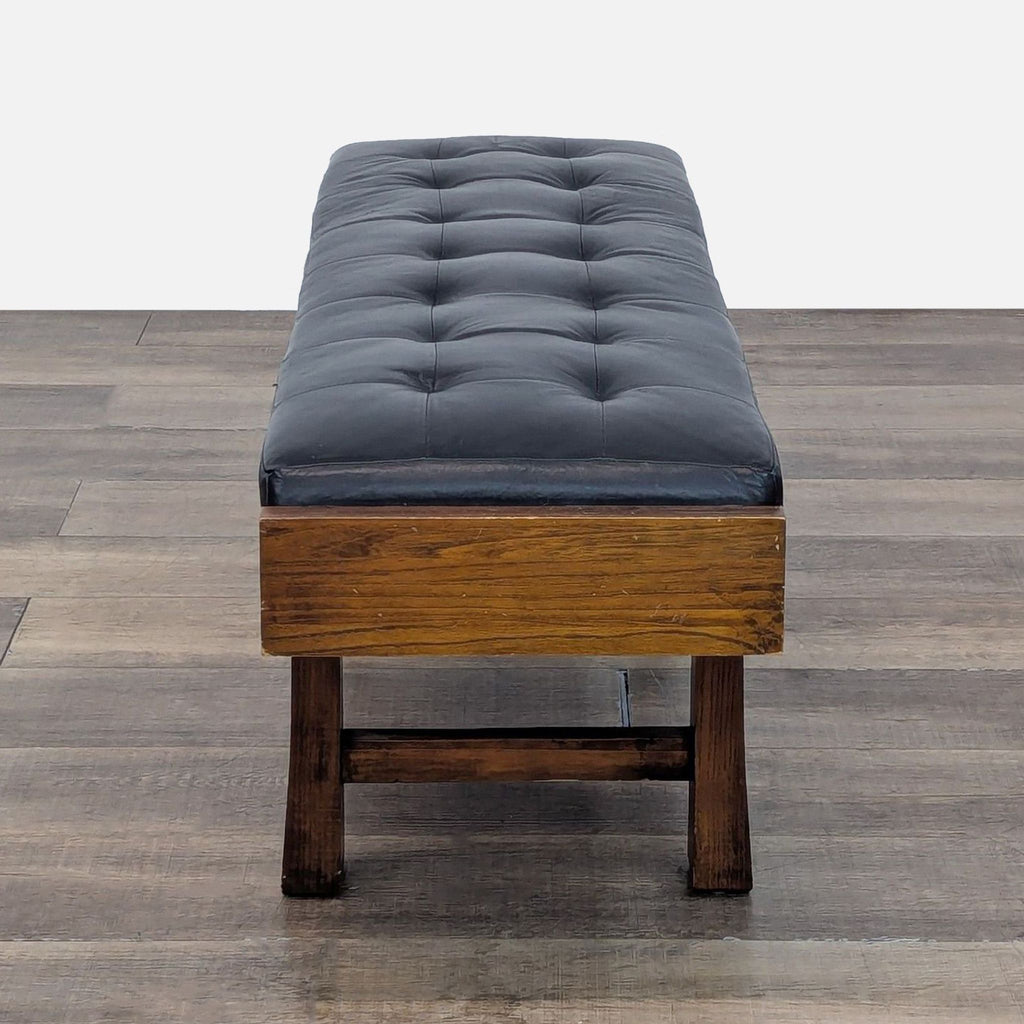 2. Side view of a tufted bench, featuring dark wood and cushions.