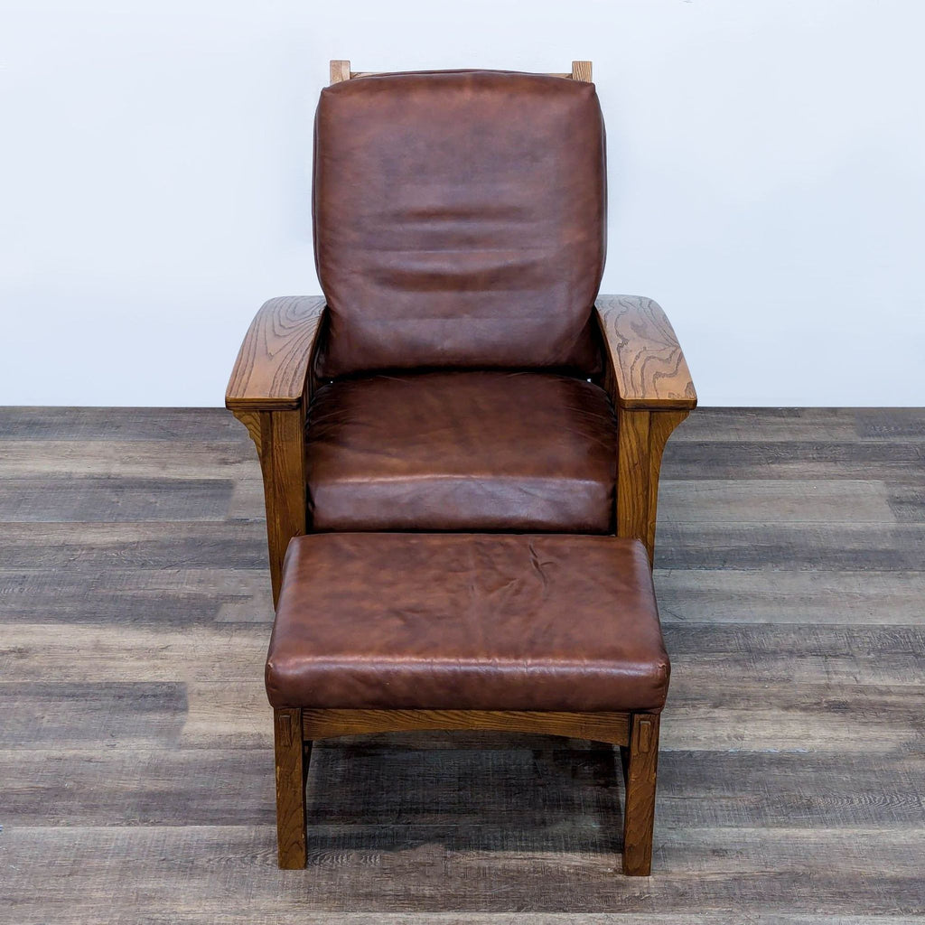 Front view of wooden lounge chair and ottoman with leather upholstery, ideal for relaxing.