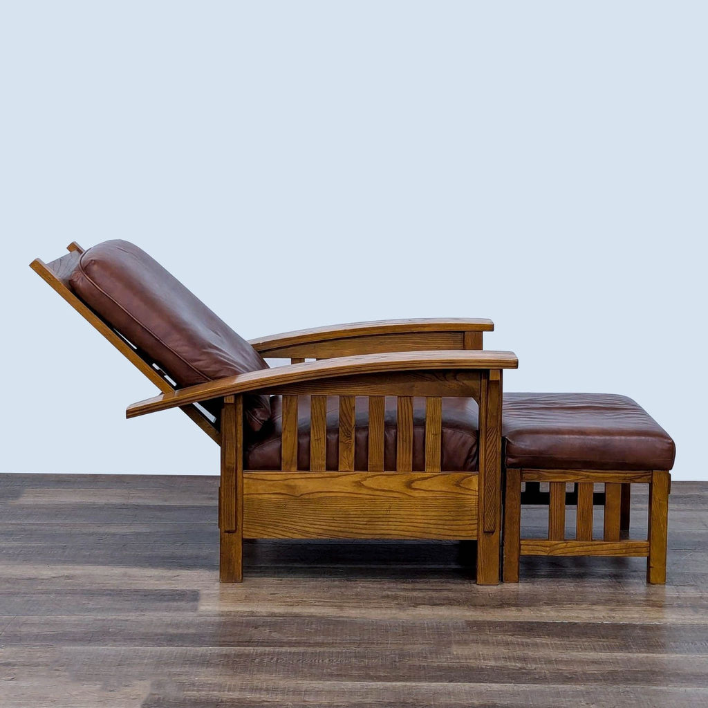 Side view of reclining lounge chair and ottoman with wooden frame and leather upholstery.