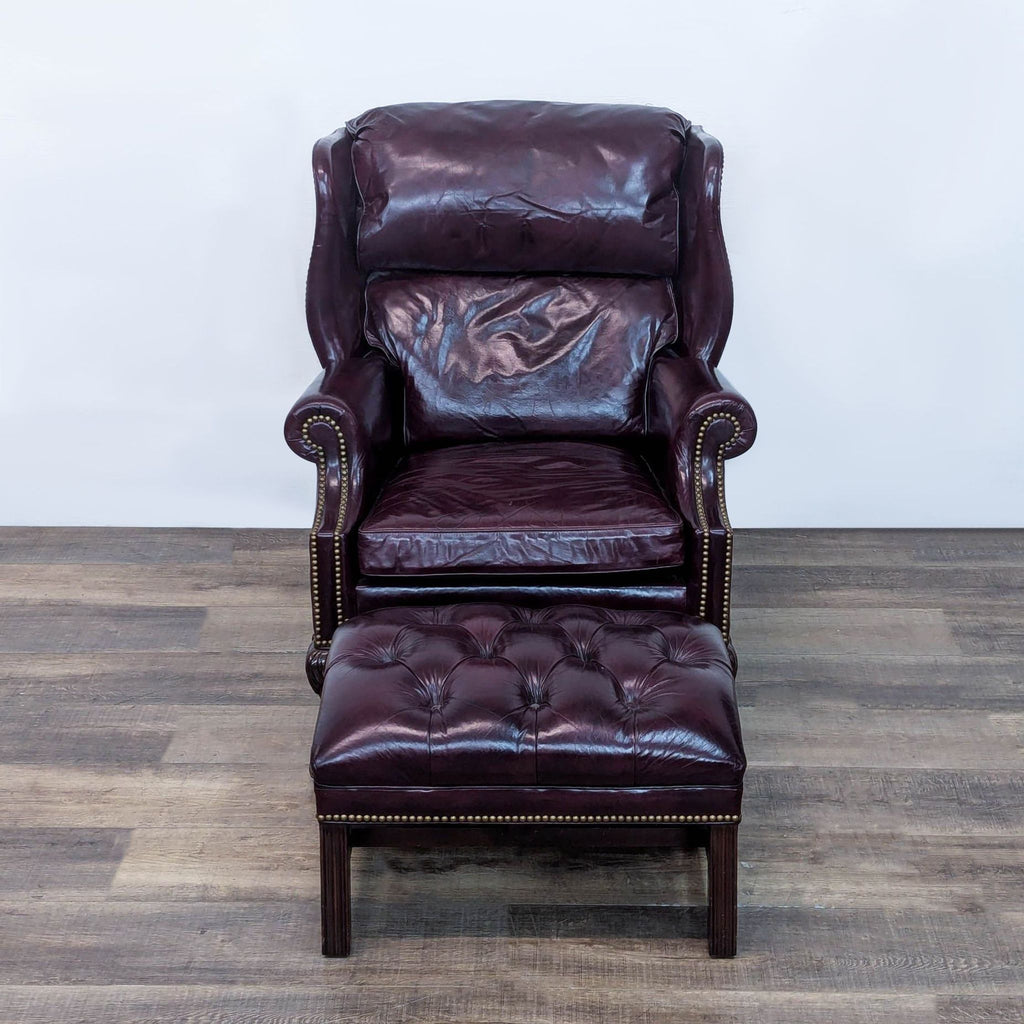 3. Hooded back chair and ottoman on mahogany claw feet, designed by Hancock & Moore.