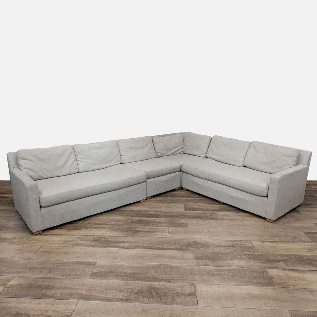 Elegant Restoration Hardware sectional; L-shape with soft upholstery and contemporary track arms design.