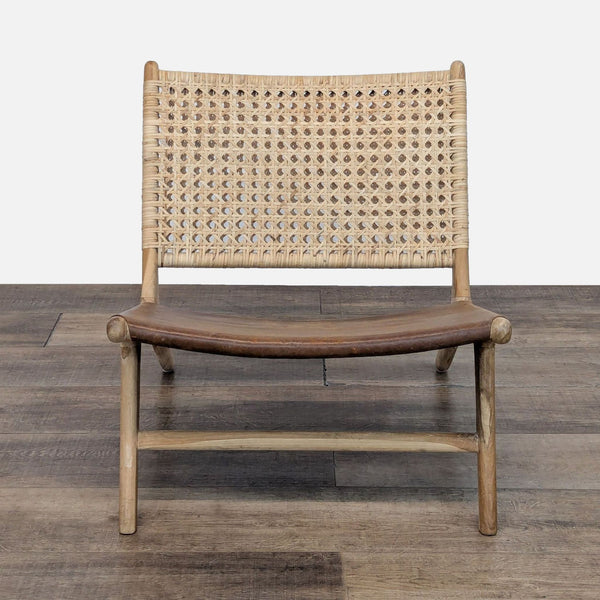 Teak chair with leather seat and woven rattan back, handcrafted in Bali.