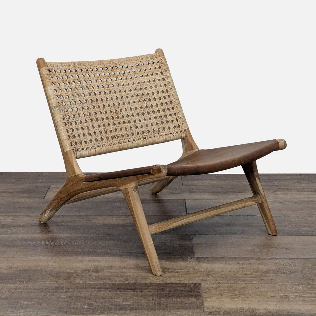 Bali-crafted chair with a woven rattan back and teak wood frame.