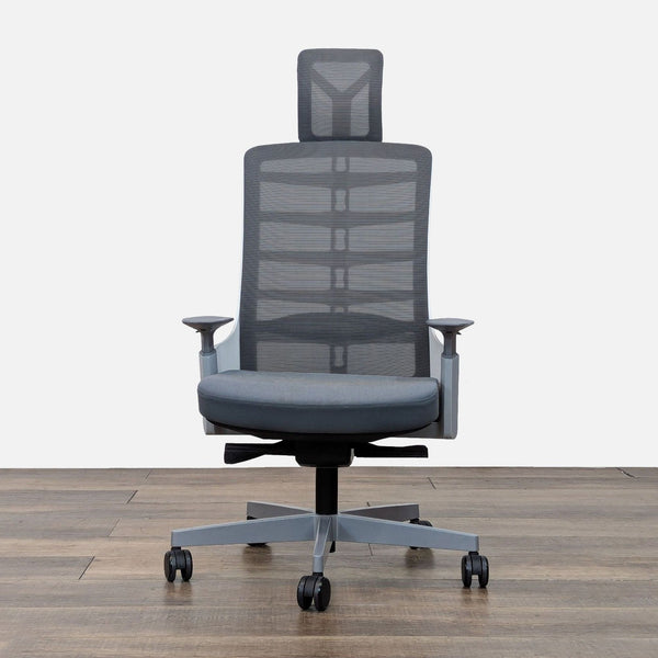 Ergonomic chair with high mesh back, adjustable headrest, and casters on a wooden floor.