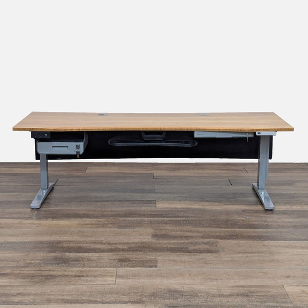 UPLIFT Desk with bamboo top, adjustable height, and lockable drawers.