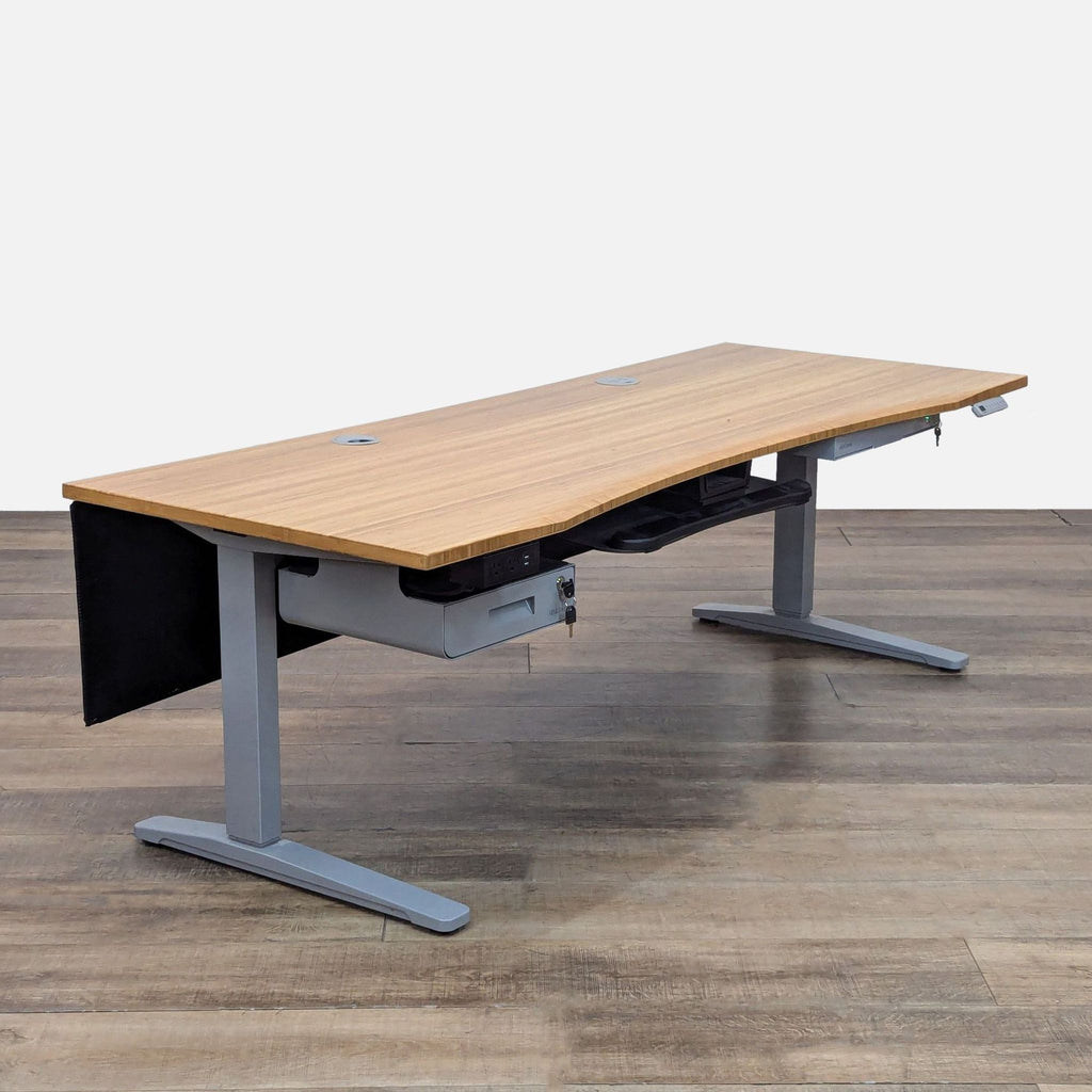 Adjustable UPLIFT Desk featuring bamboo top and lockable drawers.
