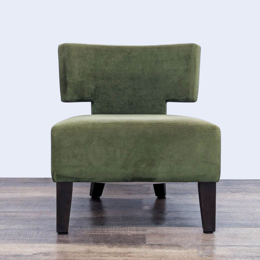 Green slipper chair with wood legs from West Elm, lounge style. 