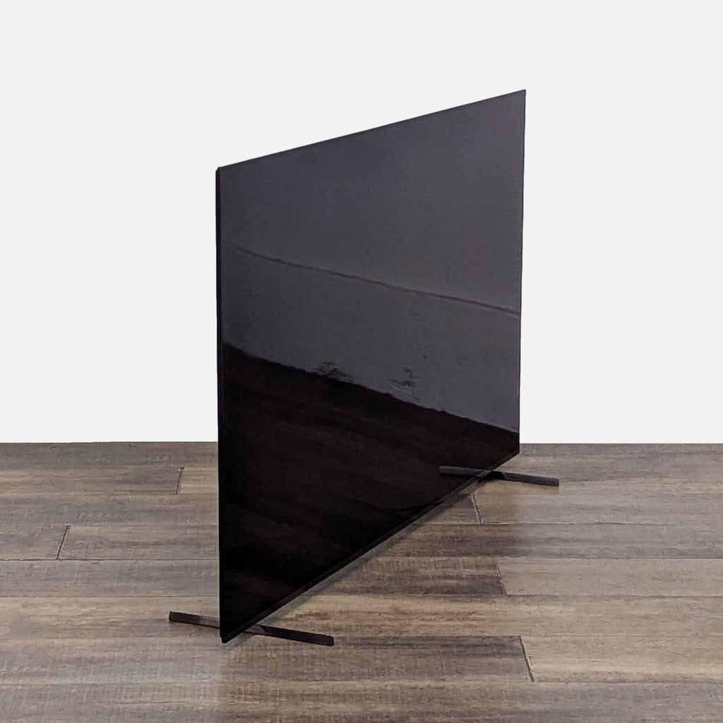 Front view of Sony Smart OLED TV on wooden floor