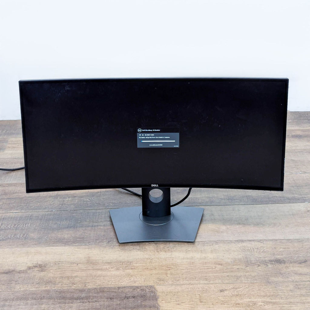 Side view of a Dell curved monitor, highlighting its sleek profile and modern stand.