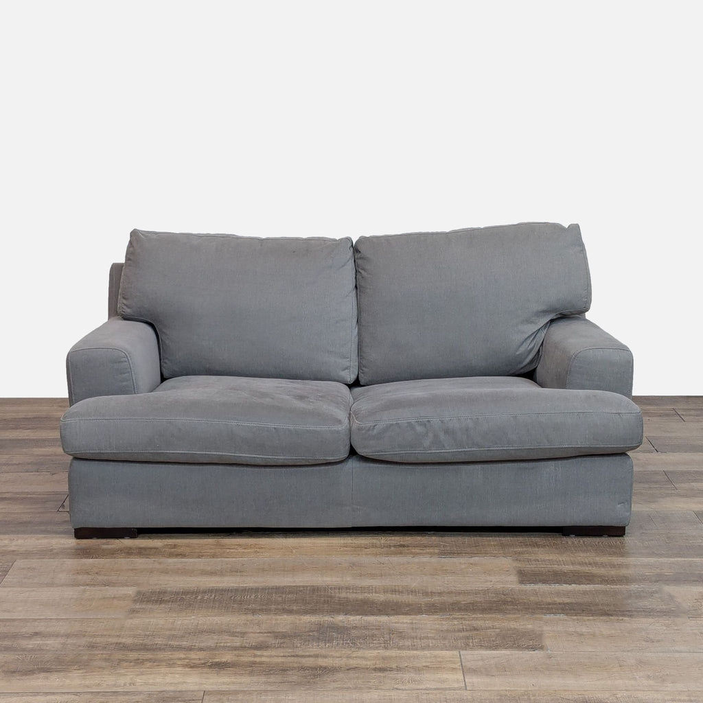 Reperch loveseat in gray fabric with clean lines and track arms.