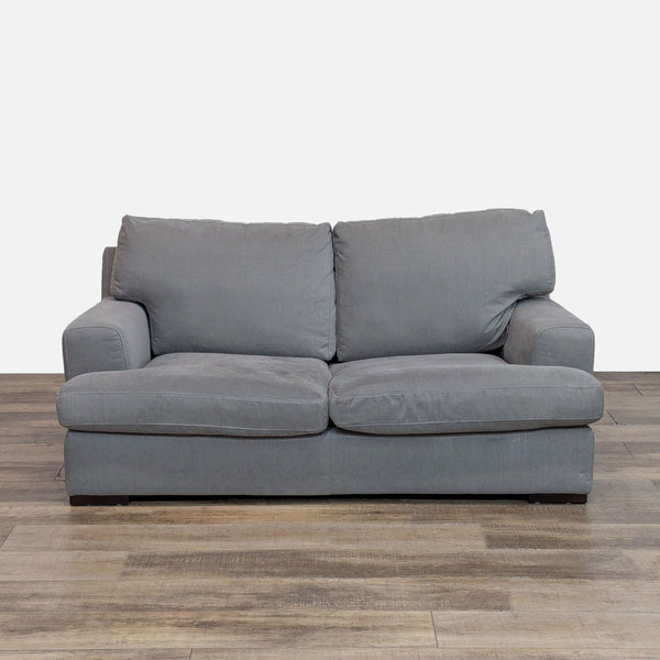 Reperch loveseat in gray fabric with clean lines and track arms.