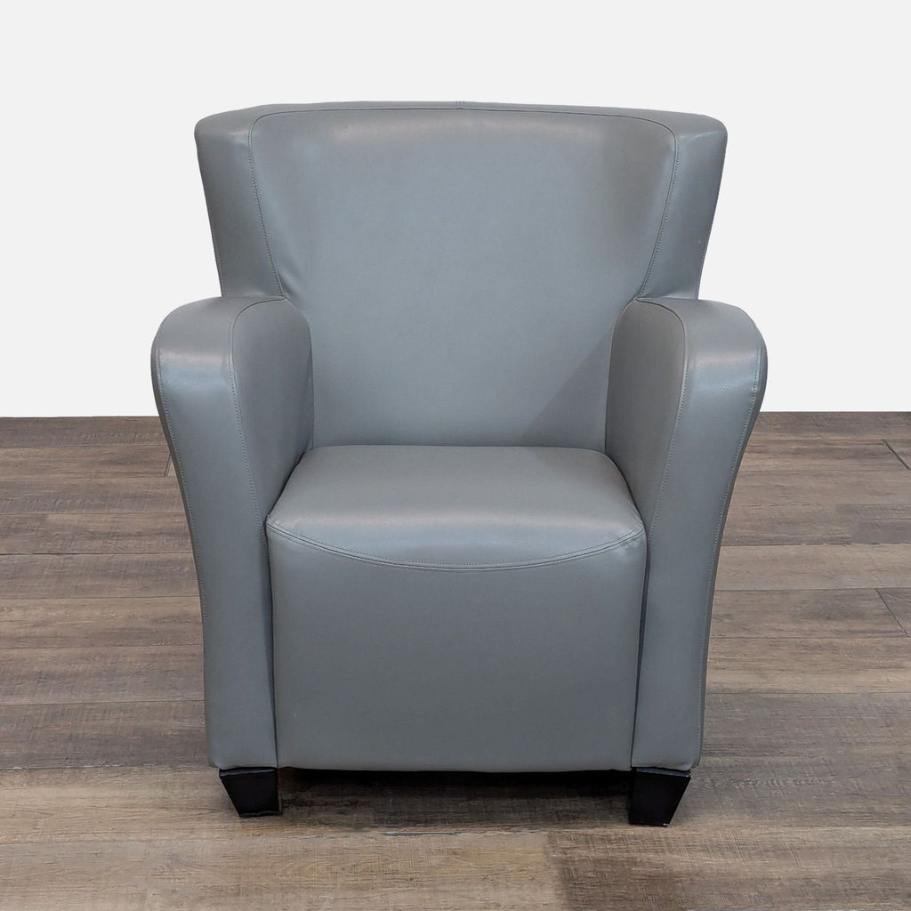 Gray faux leather lounge chair with rounded arms and tapered wood feet. Front view. Brand: Reperch.