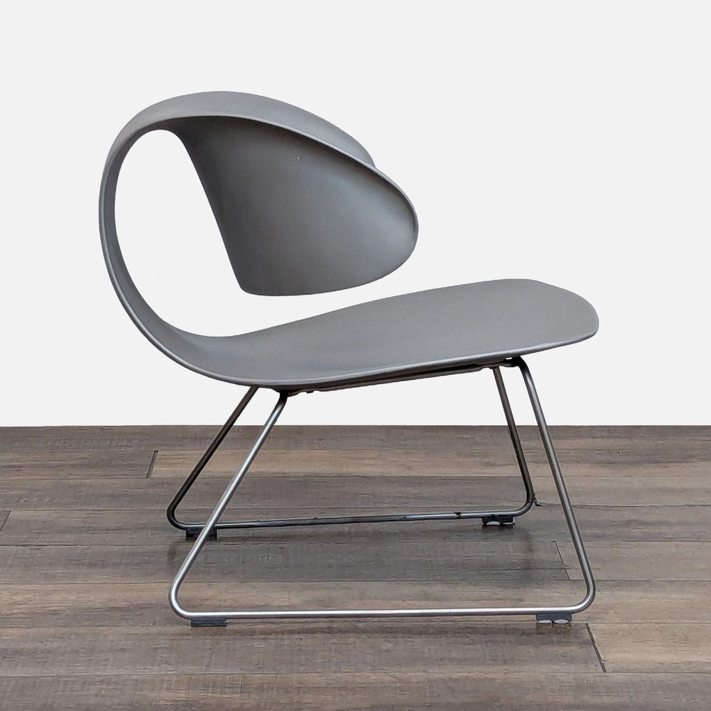 Stylish Sawaya & Moroni chair with matte finish and unique curves.  