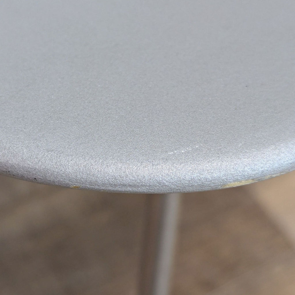Close-up of matte gray finish on modern lounge chair.  
