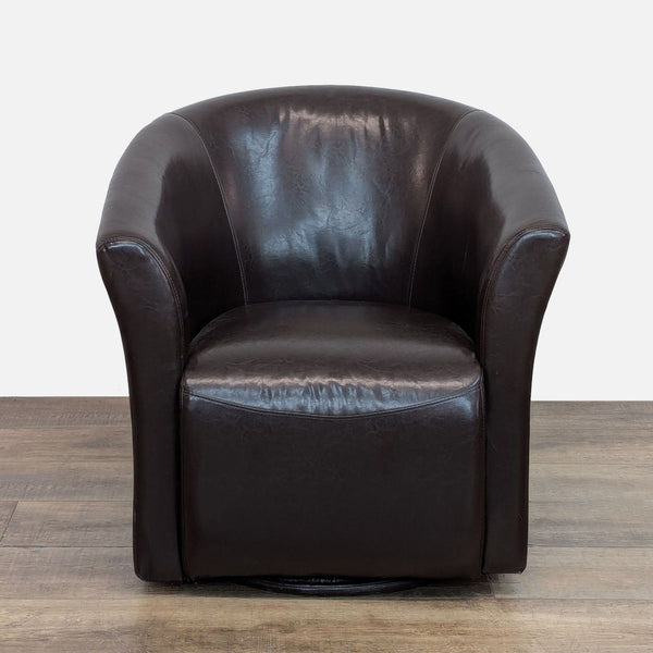 Brown faux leather swivel lounge chair with barrel back on metal base.