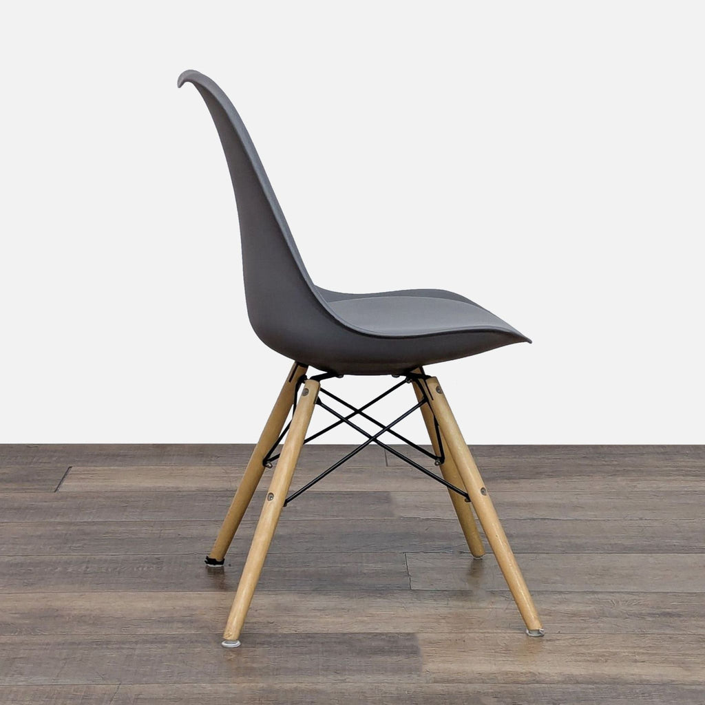 Side view of a Reperch dining chair featuring a sleek gray seat and sturdy wooden legs.