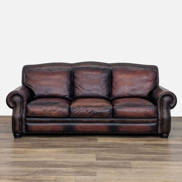 Reperch 3-seat sofa in brown leather with plush cushions, rolled arms, and nailhead trim.  