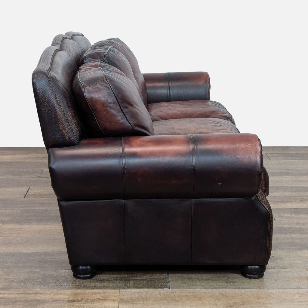 Side view of Reperch brown leather sofa showcasing rolled arms and cushioned seats.  