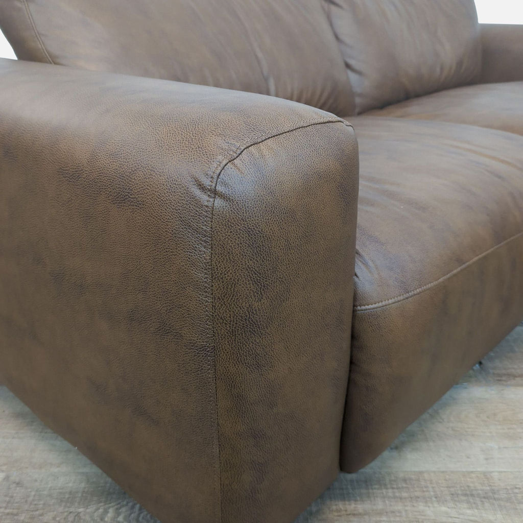 Close-up of vegan leather texture on Colamy's 3-seat sofa armrest.