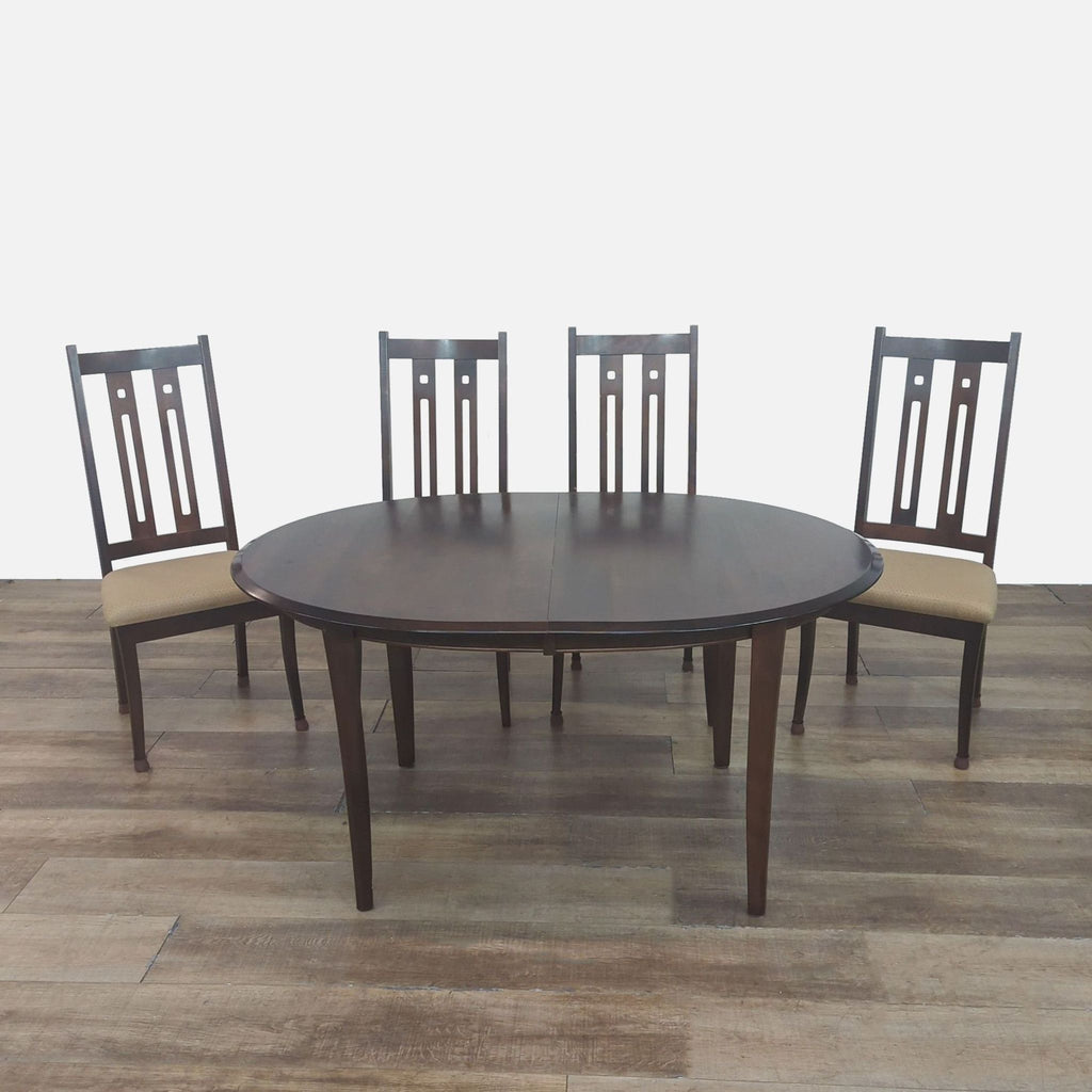 Reperch dining set with mahogany table and four upholstered chairs.