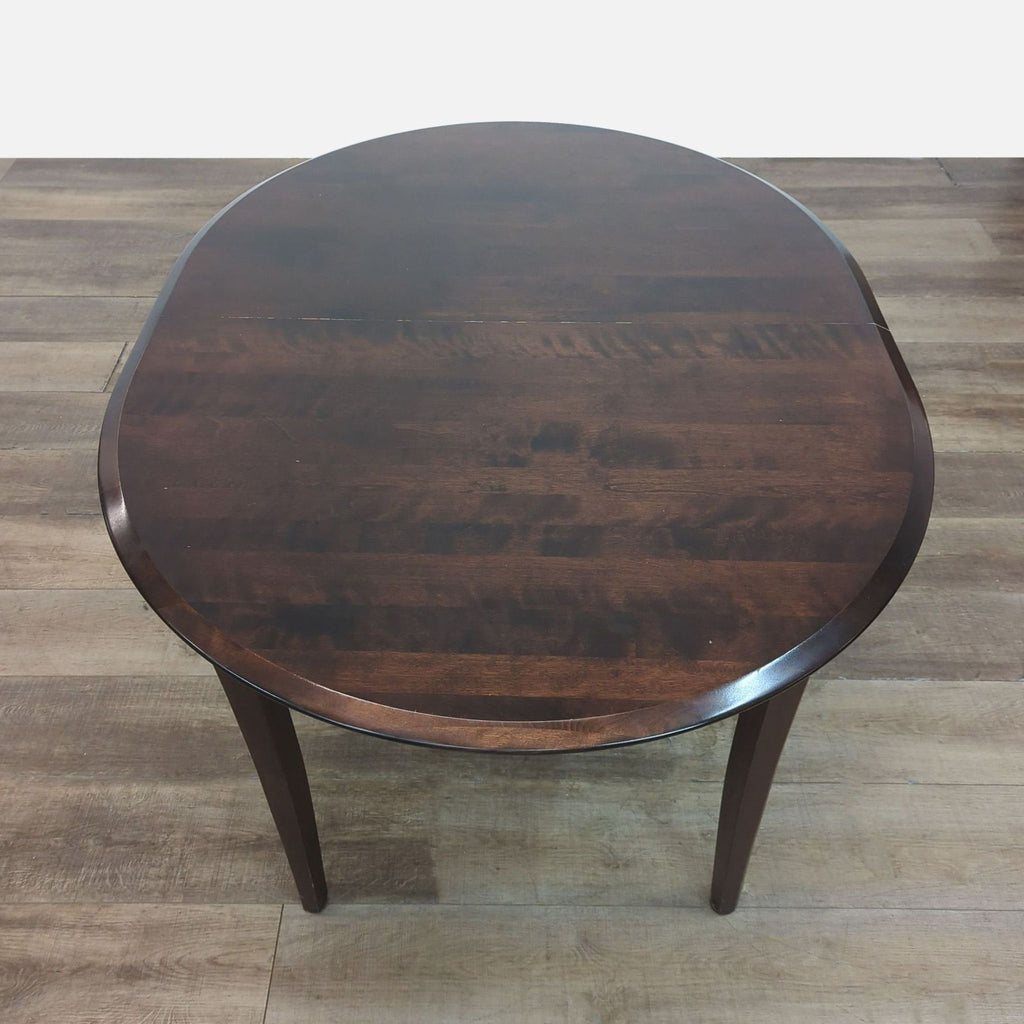 Round mahogany table from Reperch dining set.