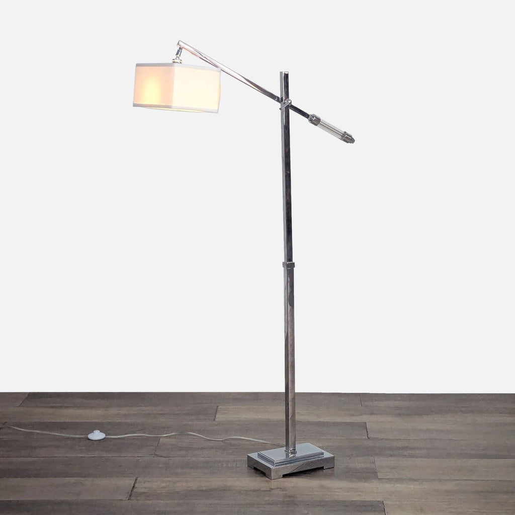 Adjustable chrome lamp with crystal details and linen shade.