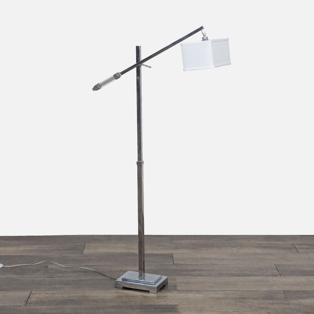 Modern floor lamp with chrome finish and off-white shade.