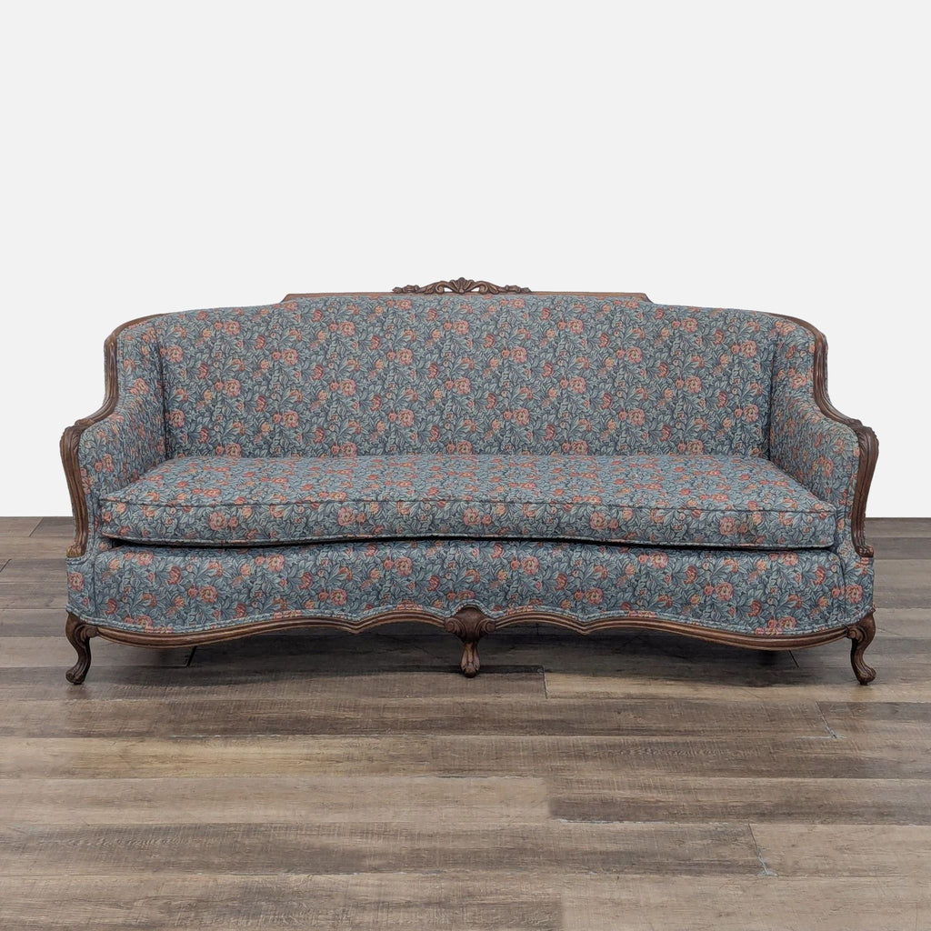 Reperch 3-seat sofa with wood carving and floral upholstery.