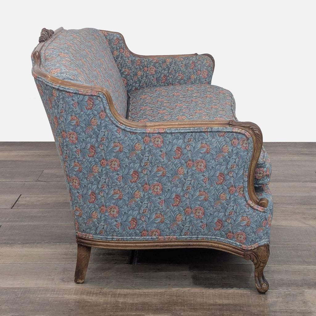 Side view of Reperch sofa showing floral pattern and wood details.
