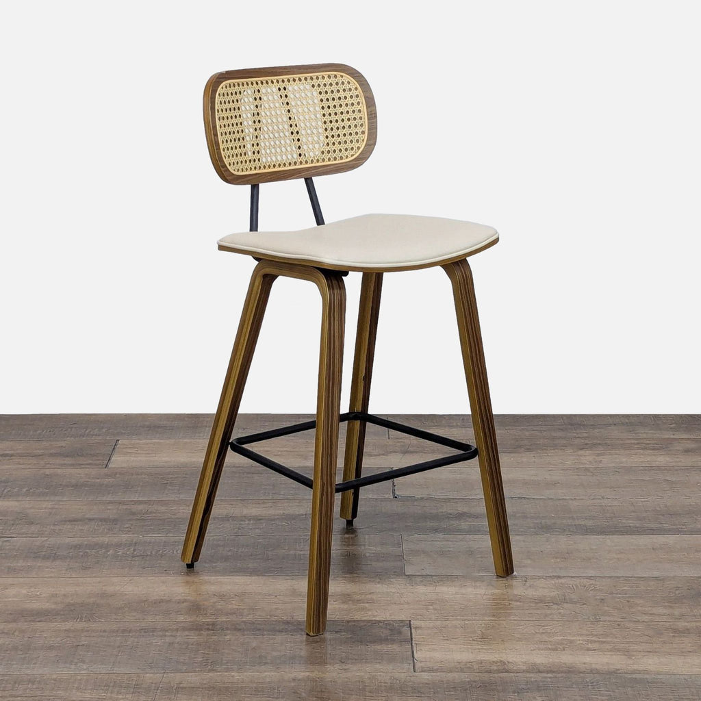 Ergonomically curved stool with solid wood legs and square footrest.