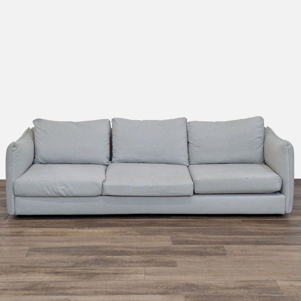 Interior Define 3-seat sofa with plush cushions and contoured arms.